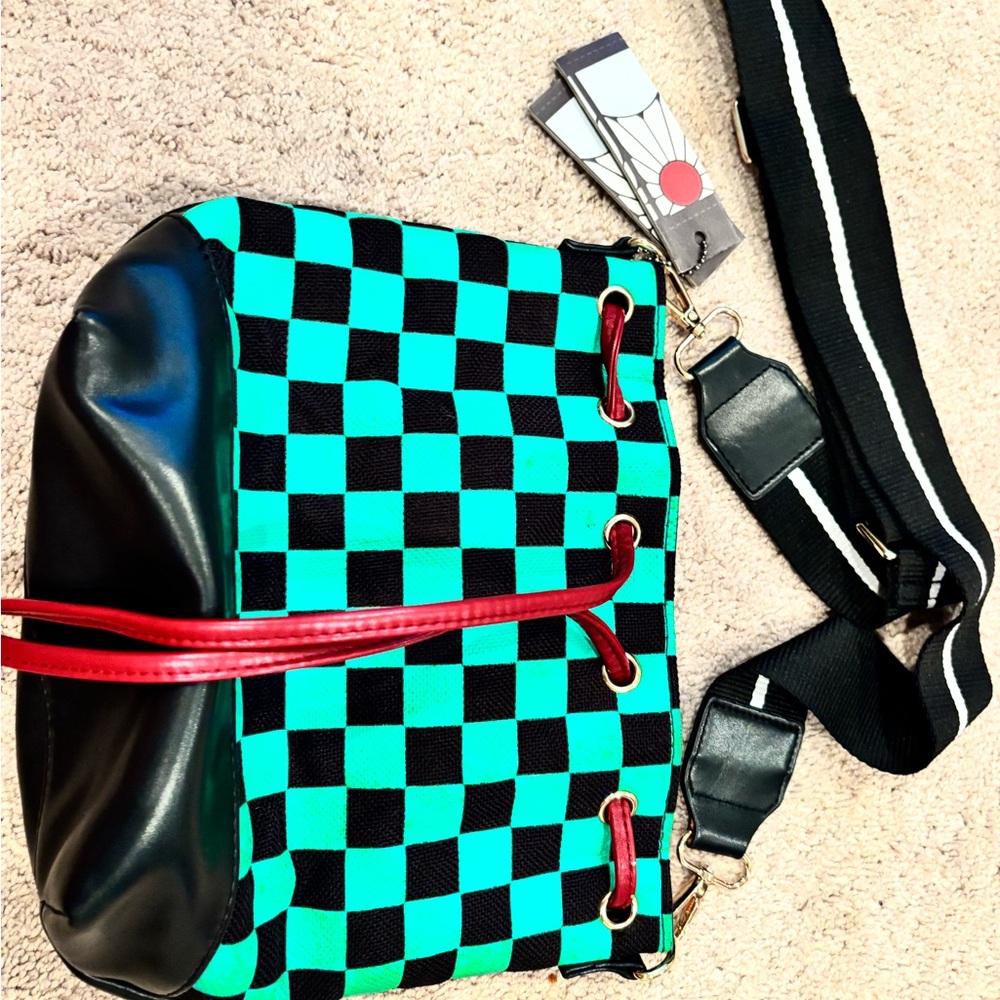 Checkered Black and Teal Bucket Bag with Red Accents
